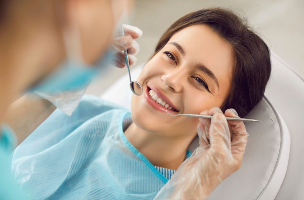 Patient receiving a dental cleaning from a hygienist to maintain oral health.